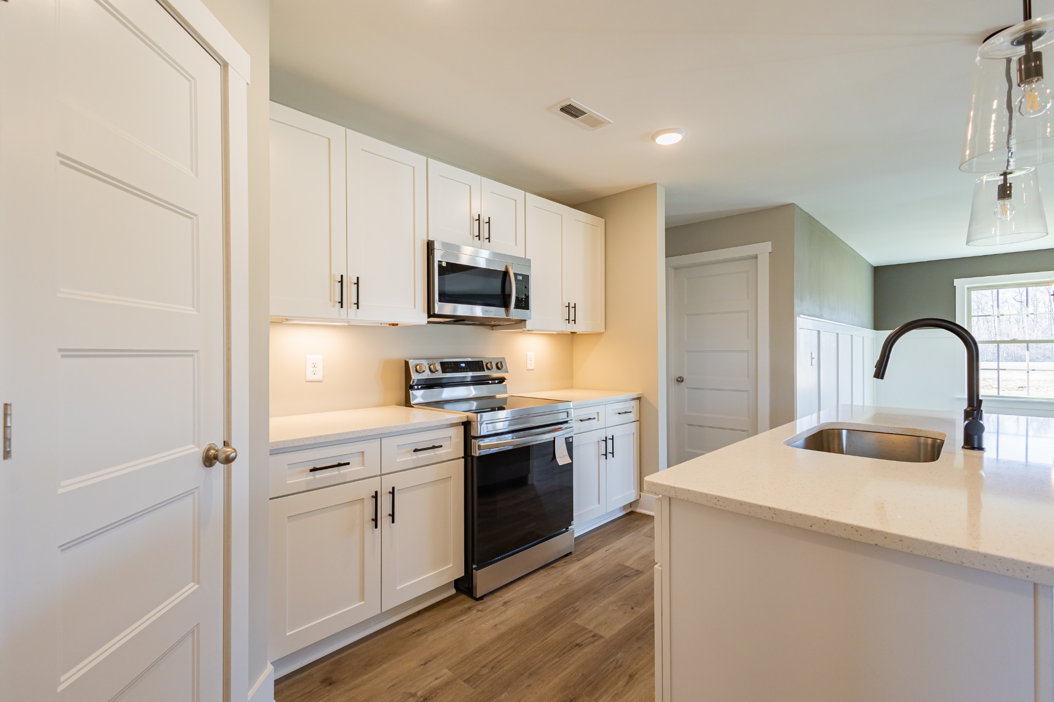 42 Brooklyn Avenue Manchester, TN 37355 - Photo 26 of 64 a kitchen with white cabinets and stainless steel appliances