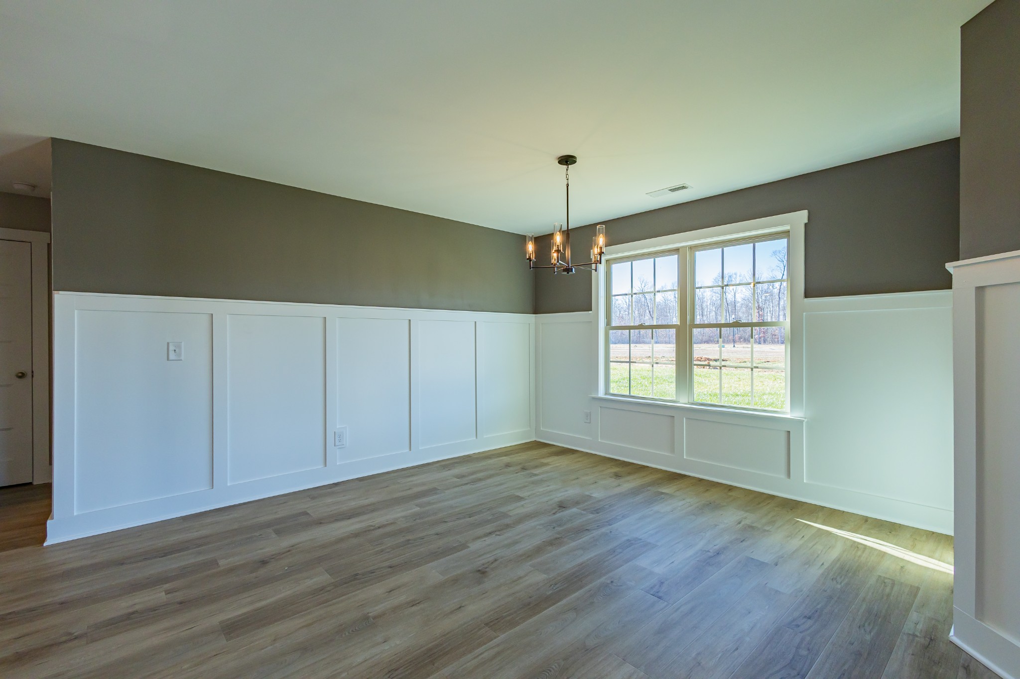42 Brooklyn Avenue Manchester, TN 37355 - Photo 28 of 64 an empty room with wooden floor and windows