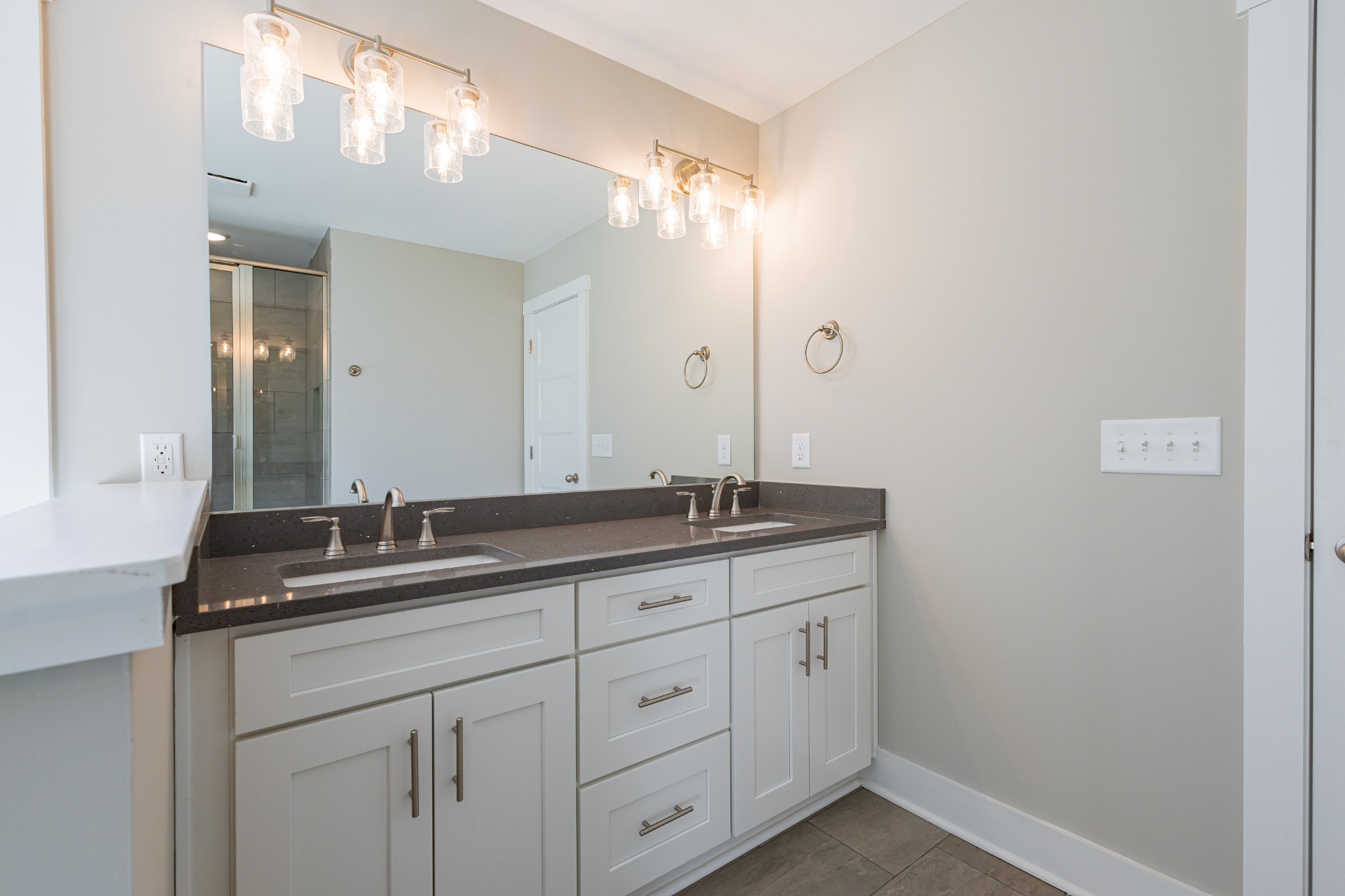 42 Brooklyn Avenue Manchester, TN 37355 - Photo 38 of 64 a bathroom with a granite countertop sink and a mirror