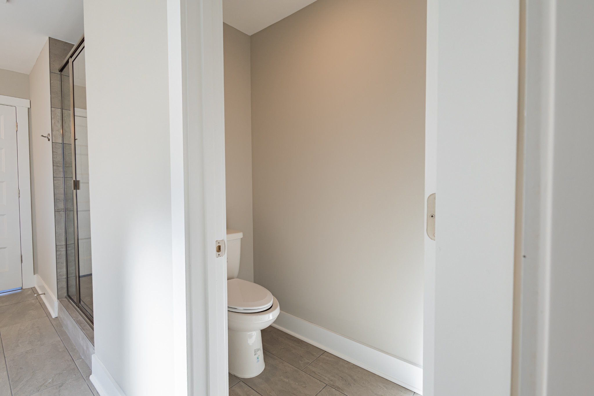 42 Brooklyn Avenue Manchester, TN 37355 - Photo 43 of 64 a white toilet sitting next to a white cabinet