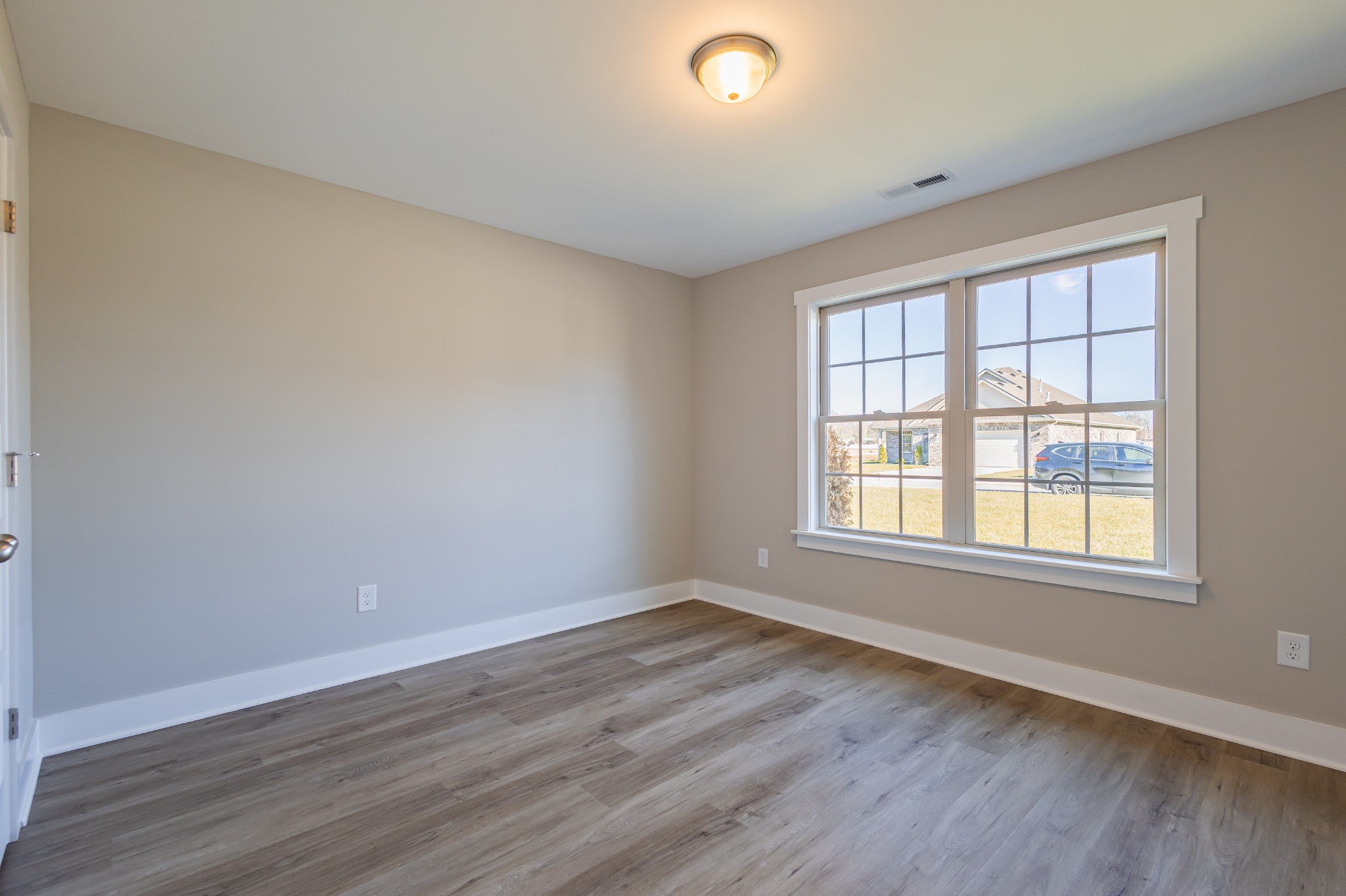 42 Brooklyn Avenue Manchester, TN 37355 - Photo 48 of 64 an empty room with wooden floor and windows