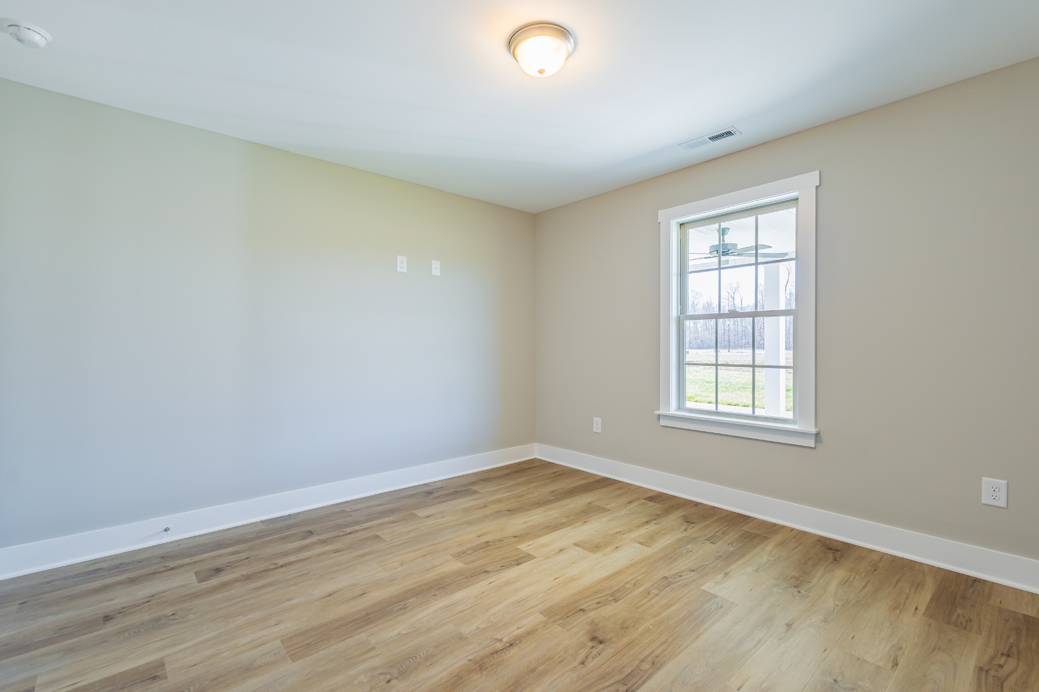 42 Brooklyn Avenue Manchester, TN 37355 - Photo 54 of 64 an empty room with wooden floor and windows