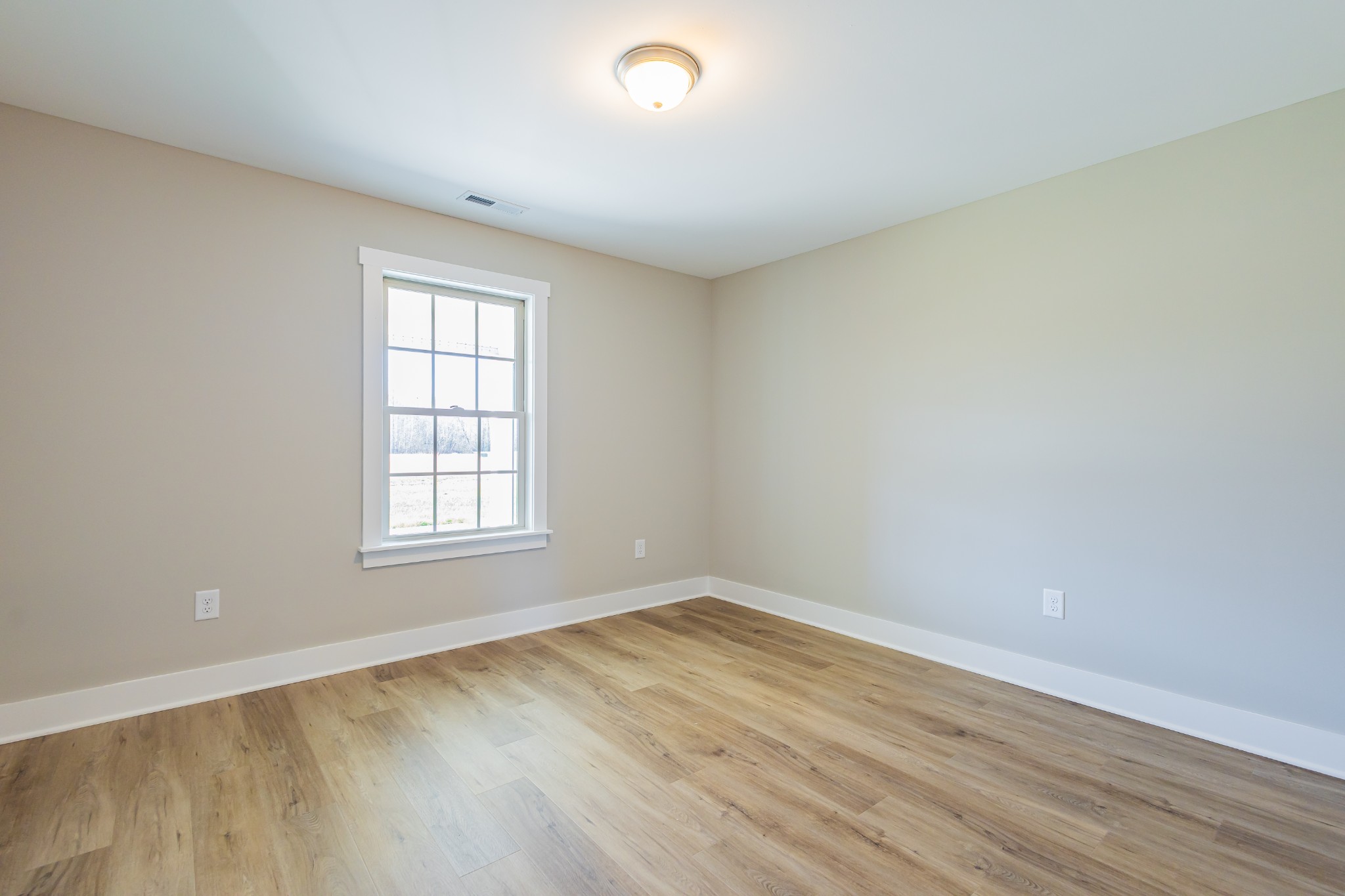 42 Brooklyn Avenue Manchester, TN 37355 - Photo 55 of 64 an empty room with wooden floor and windows
