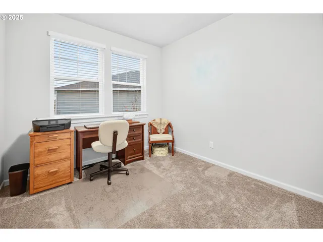 a workspace with furniture and a window