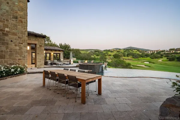 a aerial view of a house with swimming pool outdoor seating and yard