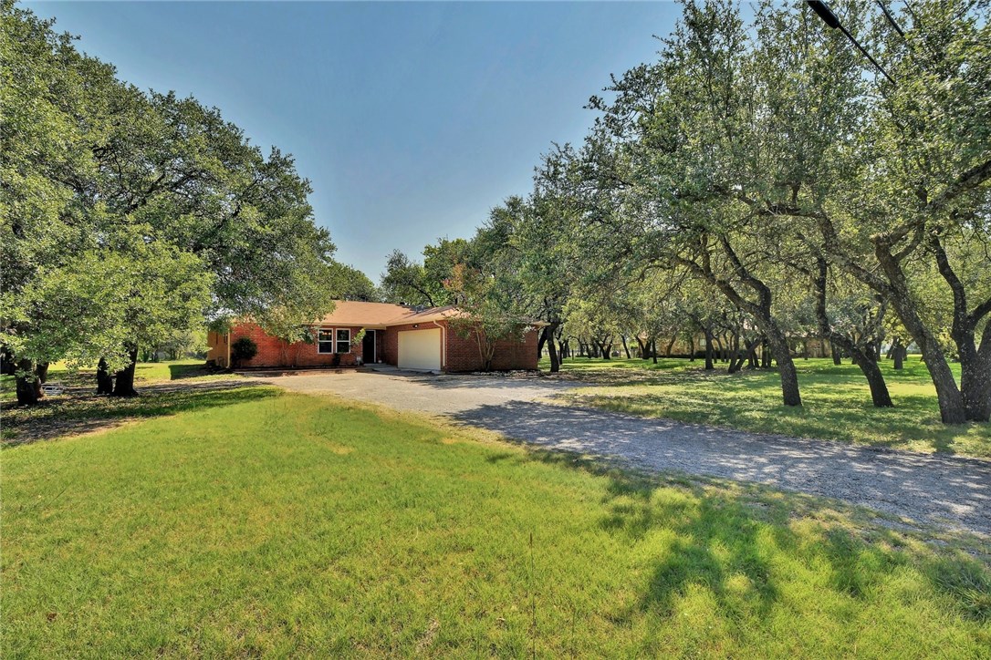 1902 Mockingbird Lane Leander, TX 78641 - Photo 1 of 1 a view of a yard with a house