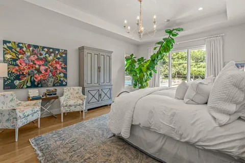 a bed room with a bed window and couch