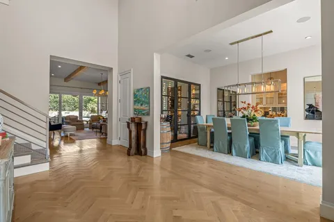 a view of a livingroom with furniture and an entryway