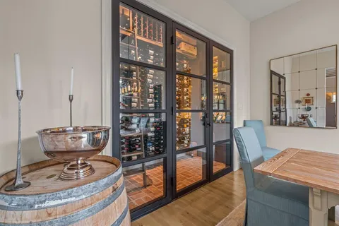 a dining room with furniture and wooden floor