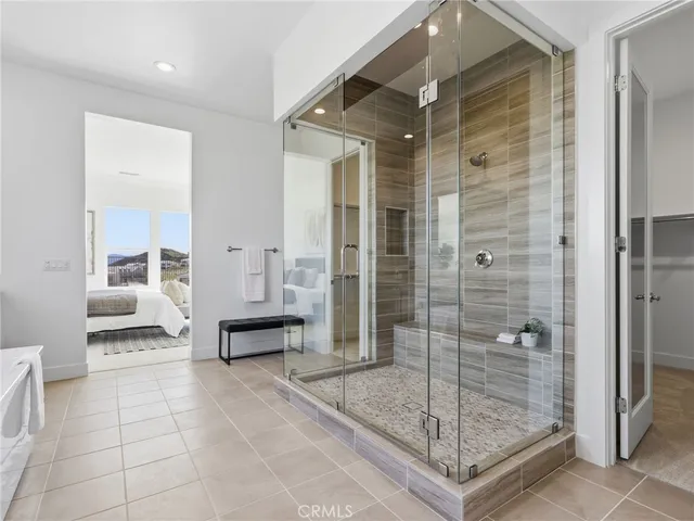 a bathroom with a shower and a sink