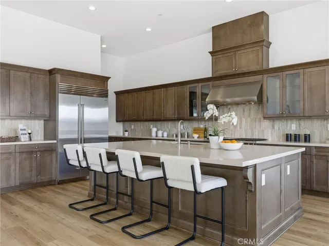a kitchen with a sink cabinets and wooden floor