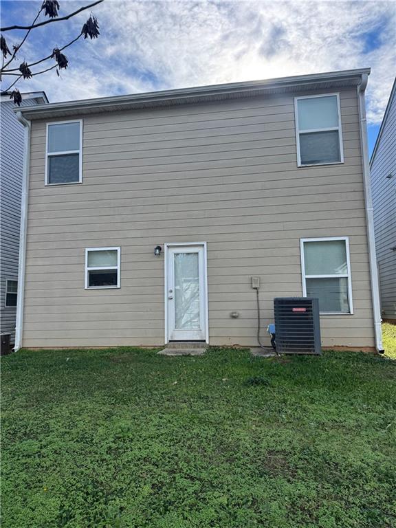 1579 Leonard Street Hampton, GA 30228 - Photo 2 of 25 a view of a house with a yard