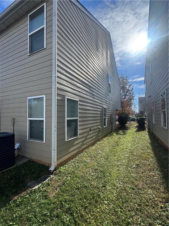1579 Leonard Street Hampton, GA 30228 - Photo 3 of 25 a backyard of a house with lots of green space