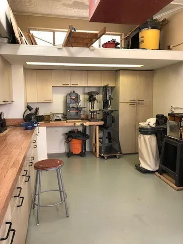 a kitchen with stainless steel appliances granite countertop a sink and a stove