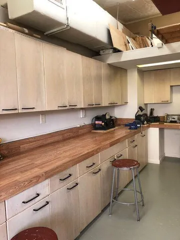 a kitchen with a sink and cabinets