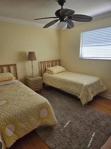 a bedroom with bed and window