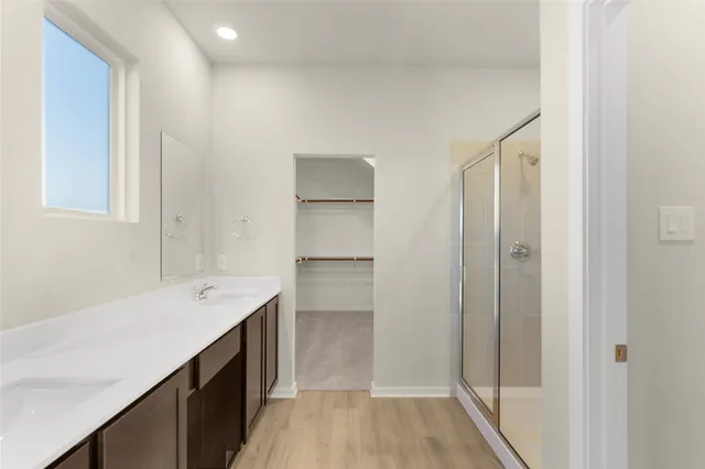 a view of a patio with couches table and chairs and potted plants