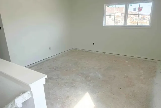 a view of a room that has a window in it