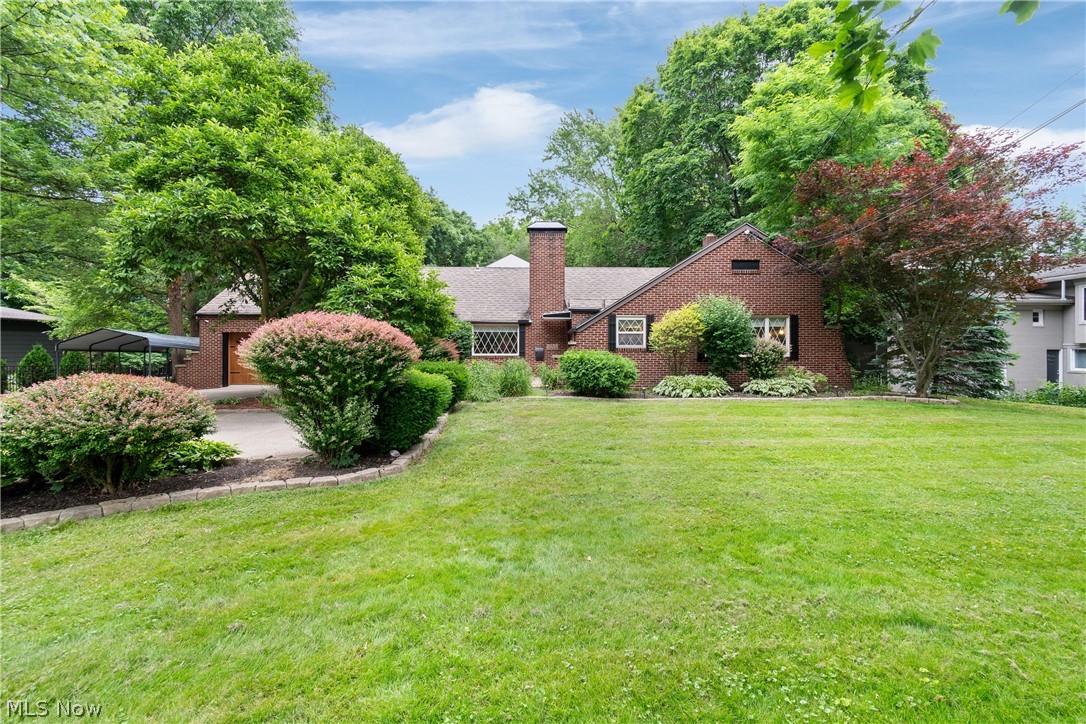 443 Merriman Road Akron, OH 44303 - Photo 6 of 44 Brick residence featuring a prominent chimney and a gabled roofline