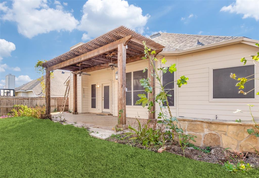 4921 Tulip Lane Fort Worth, TX 76137 - Photo 11 of 12 a front view of house with garden