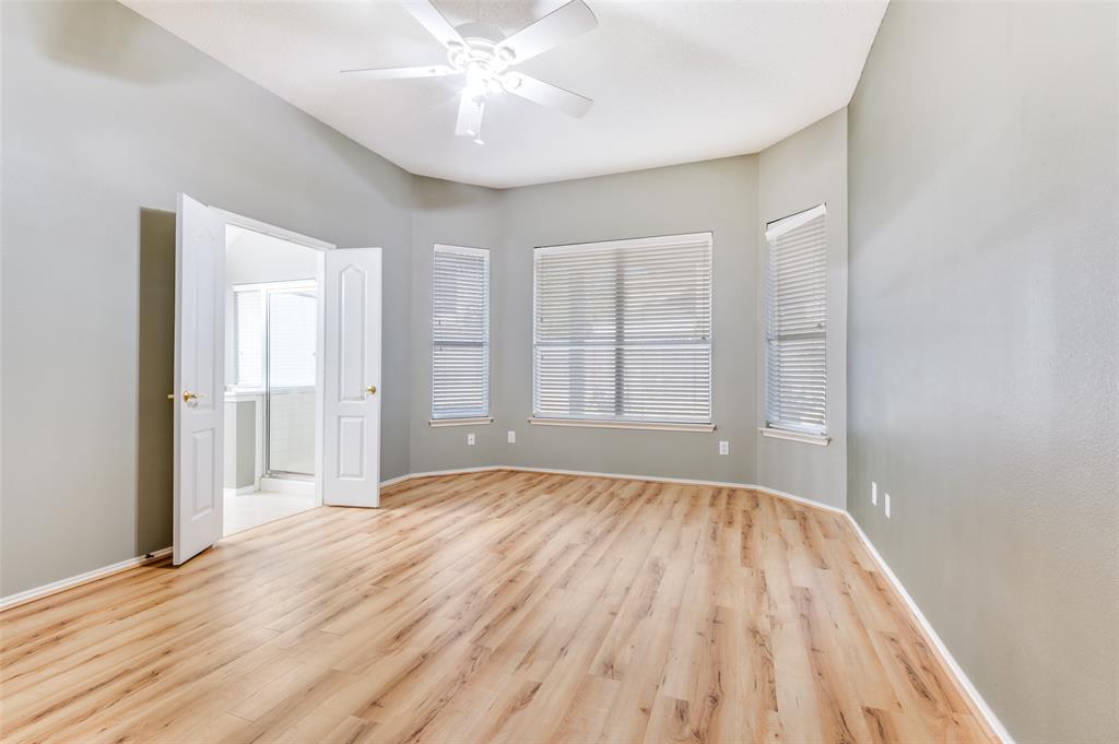 4921 Tulip Lane Fort Worth, TX 76137 - Photo 4 of 12 wooden floor in an empty room with a window