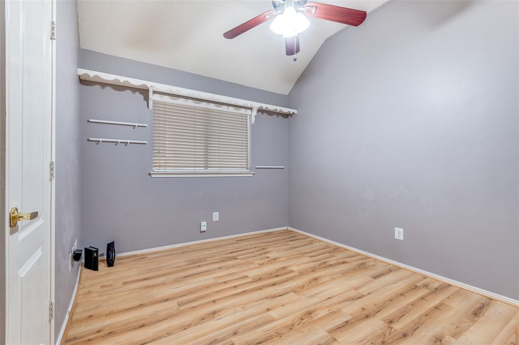 4921 Tulip Lane Fort Worth, TX 76137 - Photo 8 of 12 an empty room with a window