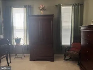 a bathroom with a sink mirror and toilet