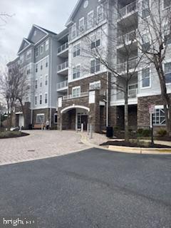700 Cattail Cove, Unit 207 Cambridge, MD 21613 - Photo 28 of 29 a front view of a building with street