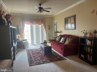 700 Cattail Cove, Unit 207 Cambridge, MD 21613 - Photo 10 of 29 a living room with furniture and a flat screen tv