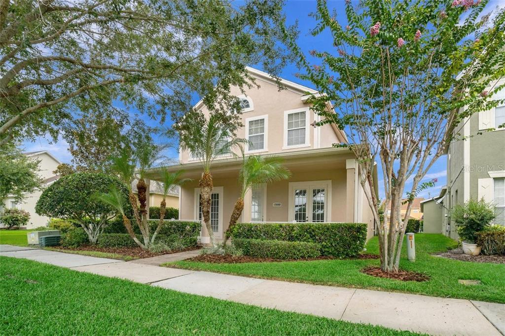 13080 Sunkiss Loop Windermere, FL 34786 - Photo 1 of 1 a front view of a house with a yard
