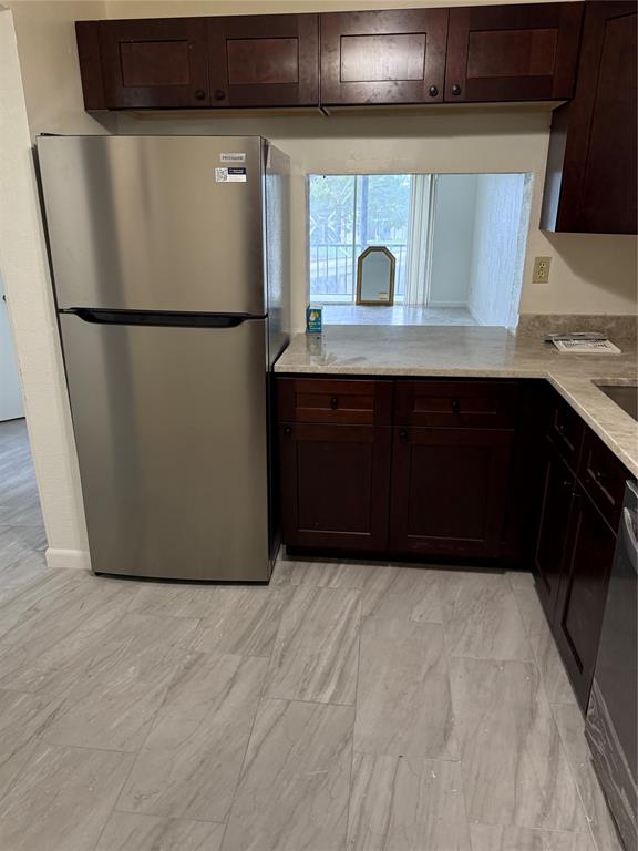 7901 North Colony Circle, Unit 201 Fort Lauderdale, FL 33321 - Photo 2 of 9 a kitchen with a refrigerator and a sink