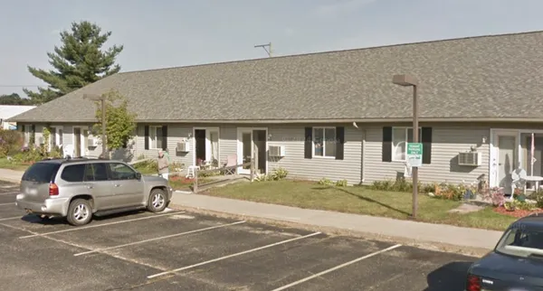 a view of a car park in front of house