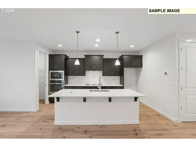 a view of kitchen island with wooden floor
