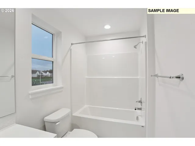 a bathroom with a toilet and a bathtub