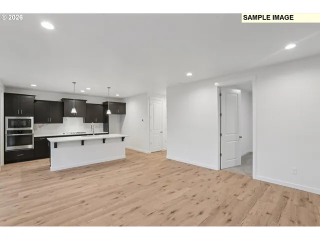 a view of kitchen with wooden floor