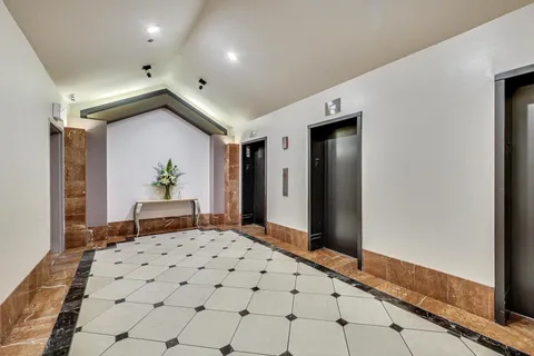 a bedroom with a bed and a dresser in it