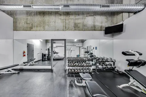 a view of room with gym equipment