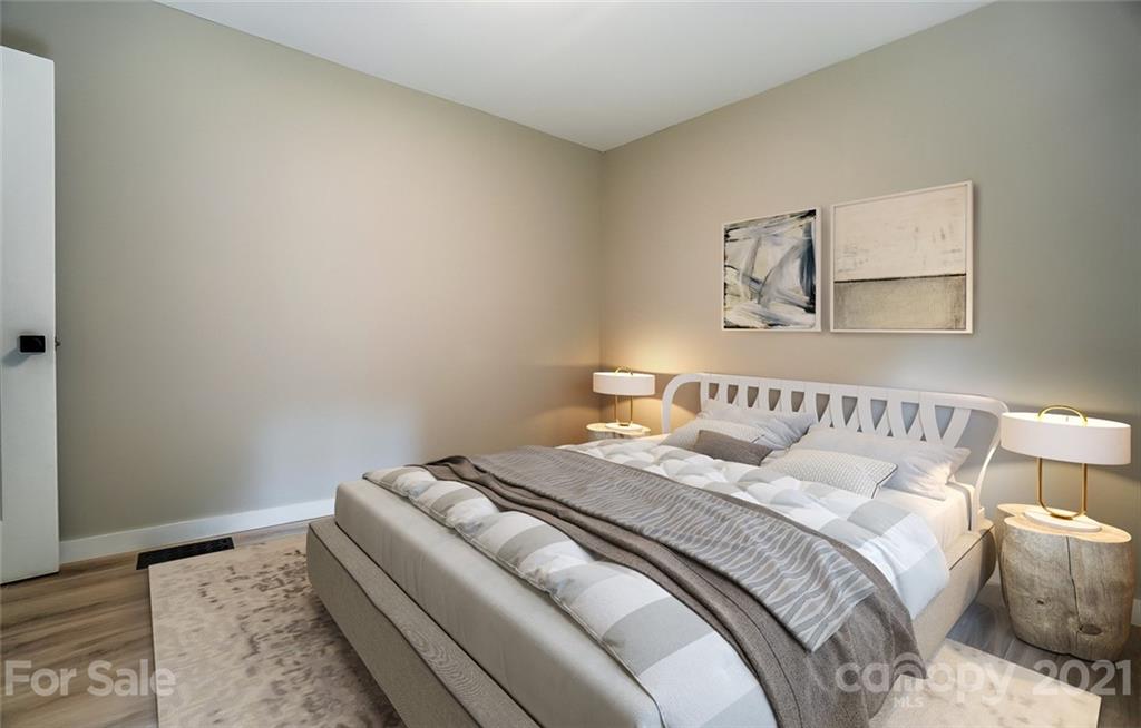 2305 Remount Road Charlotte, NC 28208 - Photo 13 of 31 a bedroom with a bed and a wooden floor