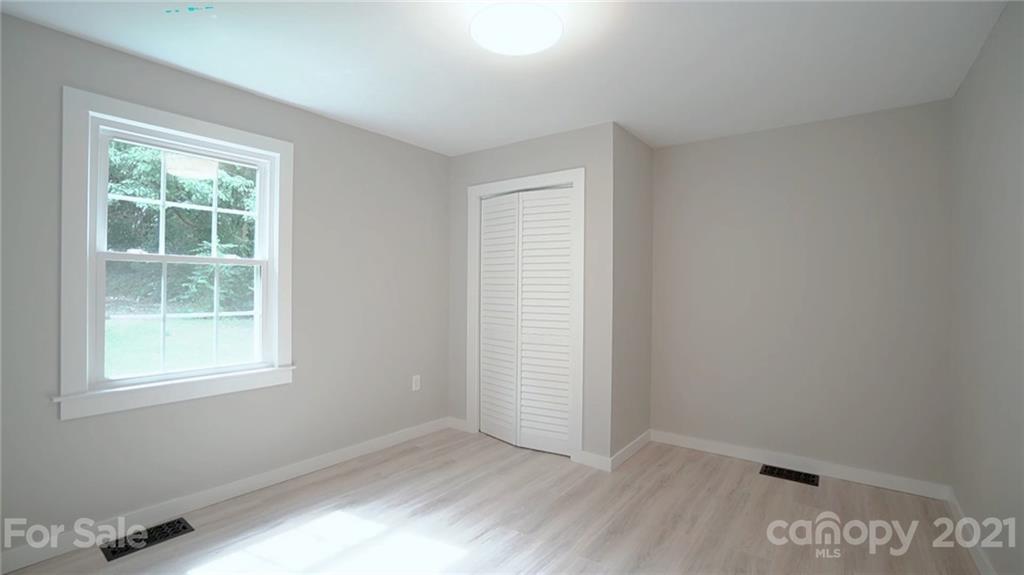 2305 Remount Road Charlotte, NC 28208 - Photo 18 of 31 an empty room with a window