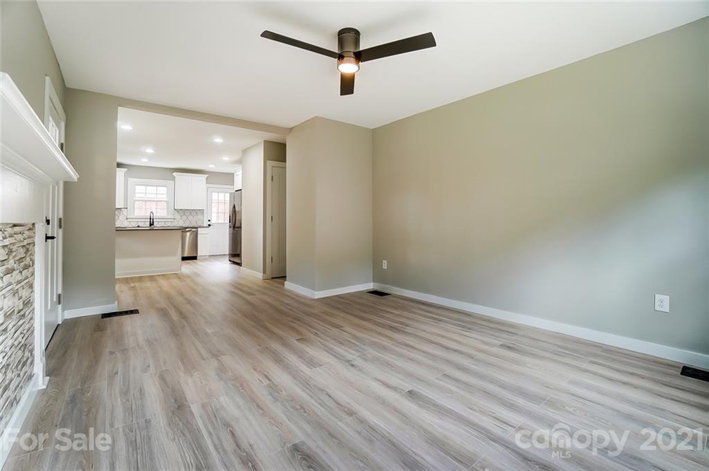 2305 Remount Road Charlotte, NC 28208 - Photo 23 of 31 a view of empty room with wooden floor and windows