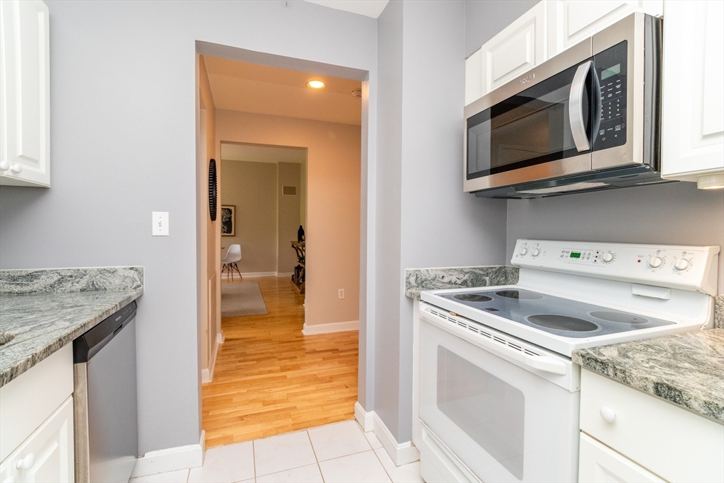 60e Glen Road, Unit 306 Brookline, MA 02445 - Photo 16 of 27 a kitchen with a stove and a microwave