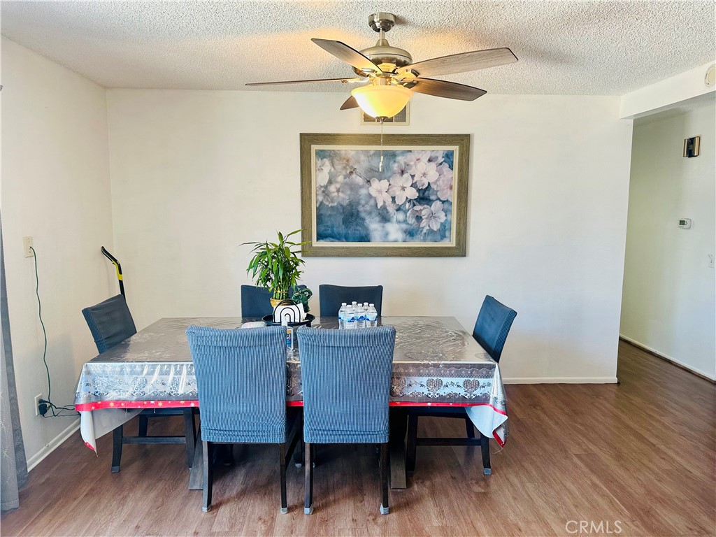 2111 Whitestone Drive Riverside, CA 92506 - Photo 11 of 29 a dining room with furniture and wooden floor