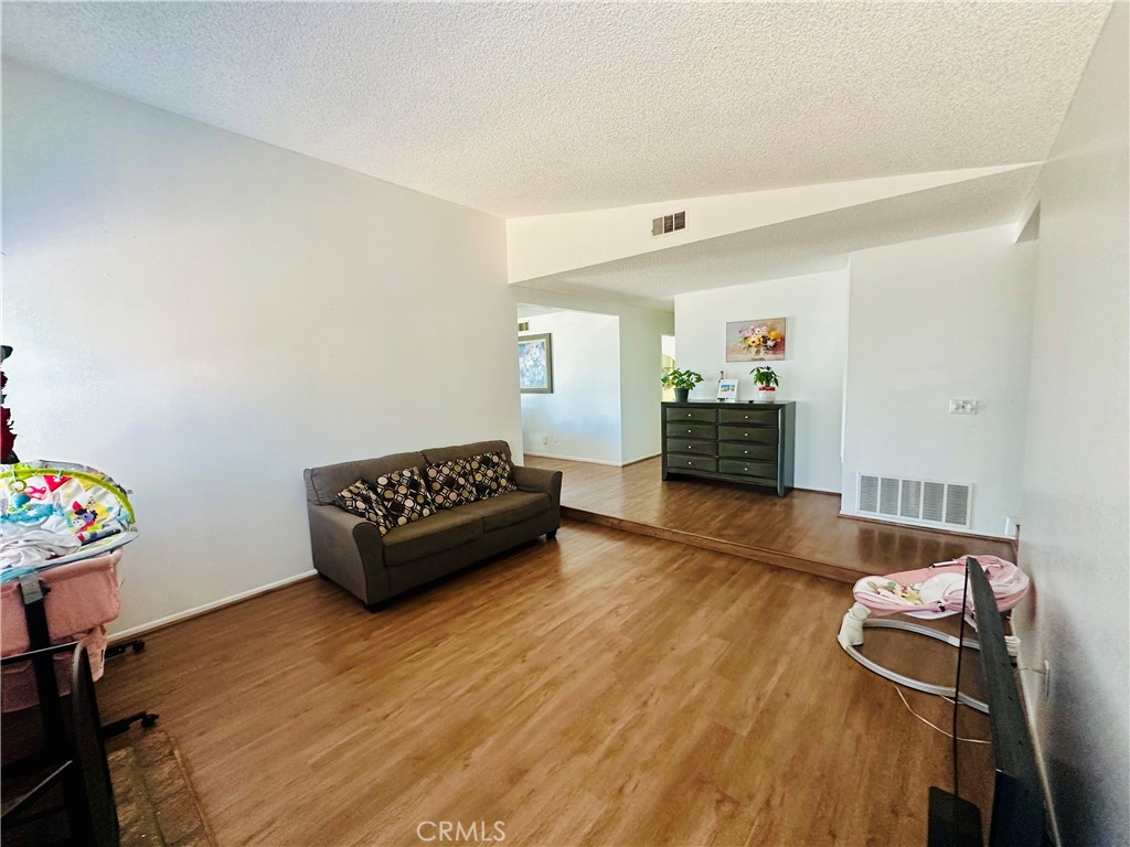 2111 Whitestone Drive Riverside, CA 92506 - Photo 13 of 29 a living room with furniture and wooden floor