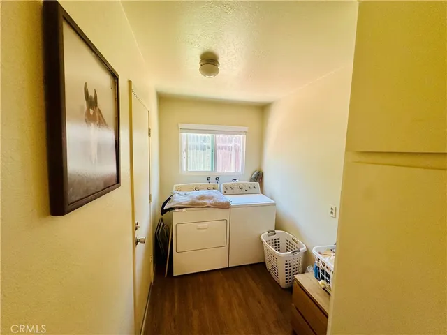 a room with a sink and wooden floor