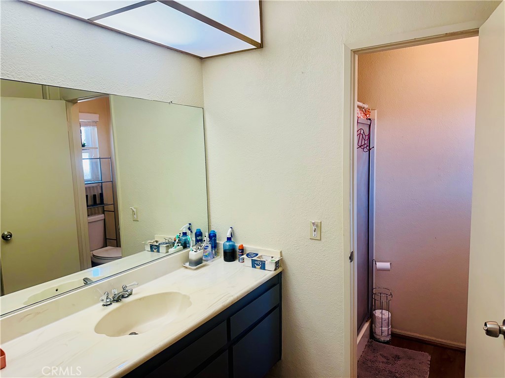2111 Whitestone Drive Riverside, CA 92506 - Photo 18 of 29 a bathroom with a sink and a mirror
