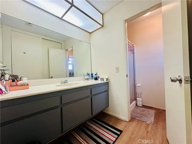 a bathroom with a double vanity sink and mirror