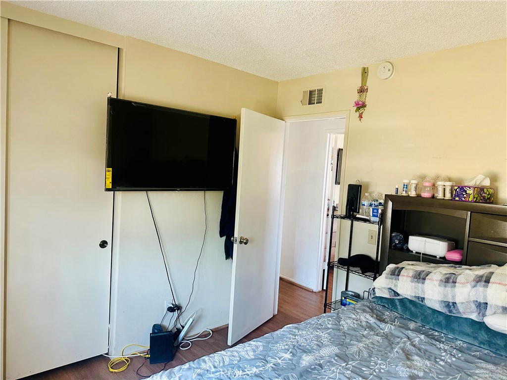 2111 Whitestone Drive Riverside, CA 92506 - Photo 20 of 29 a living room with furniture and a flat screen tv