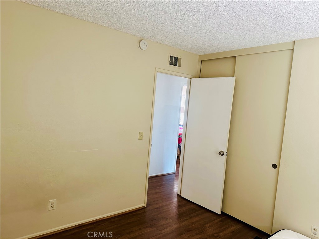 2111 Whitestone Drive Riverside, CA 92506 - Photo 21 of 29 a view of closet area with wooden floor
