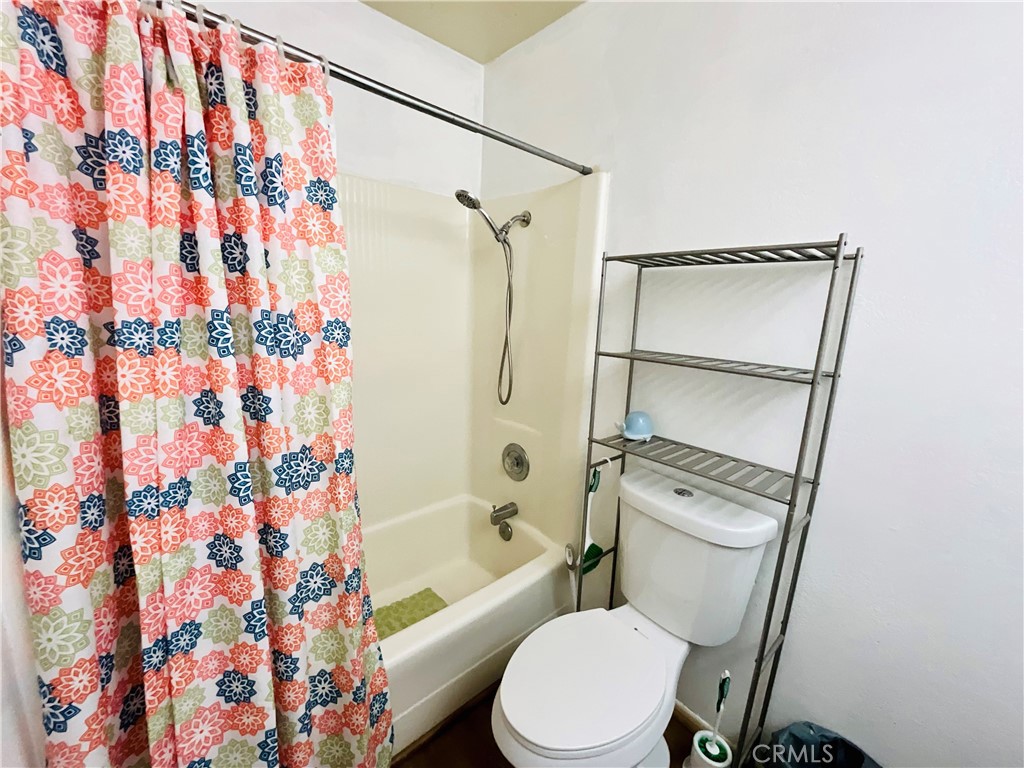 2111 Whitestone Drive Riverside, CA 92506 - Photo 23 of 29 a white toilet sitting next to a bath tub