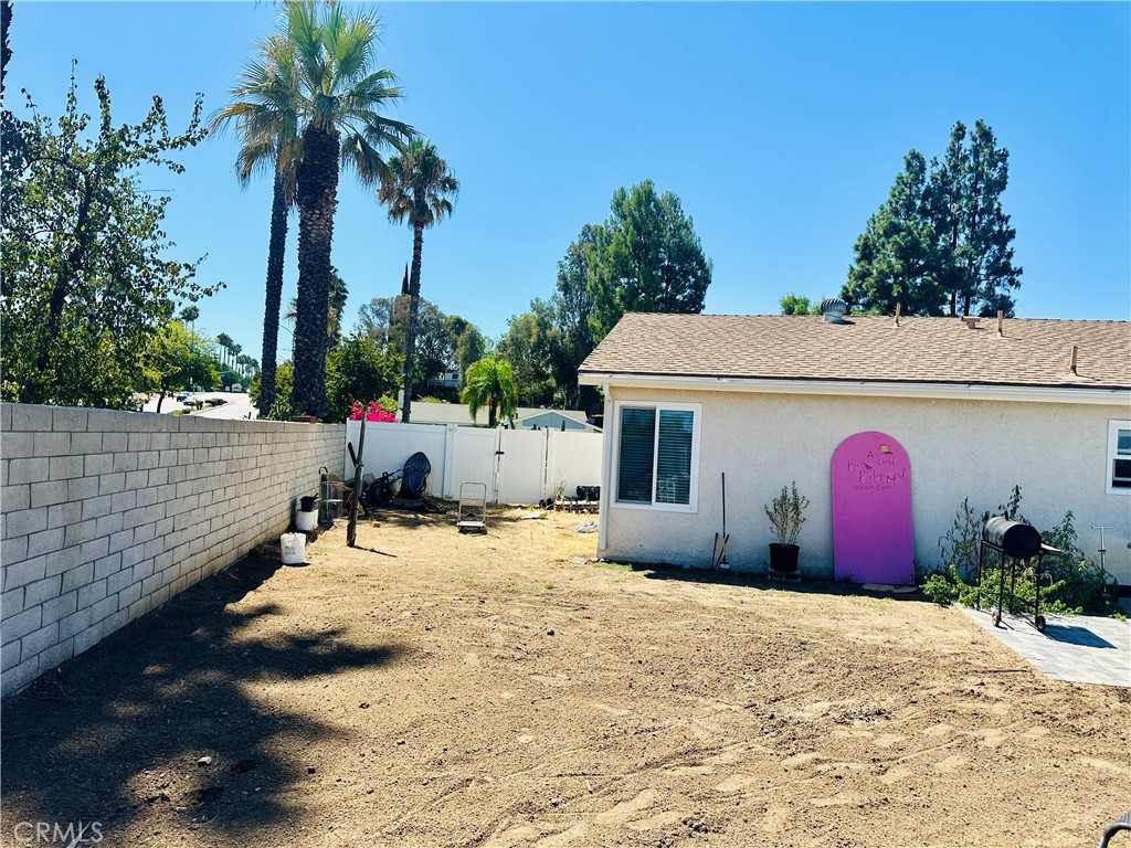 2111 Whitestone Drive Riverside, CA 92506 - Photo 27 of 29 a front view of a house with a yard and garage